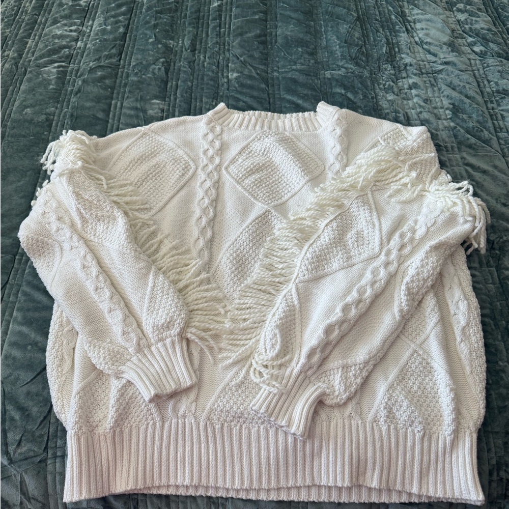 Cute sweater with fringe detail!